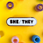 She/They Pronoun Plaque Enamel Pin - Undercover Otter - Pins - Kitty With A Cupcake - Black